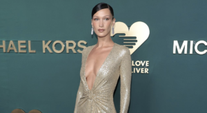 Read more about the article BELLA HADID GLIMMERS IN GOLD PLUNGING DRESS AT GOLDEN HEART AWARDS